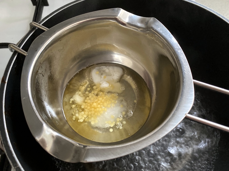 Melting shea butter and other ingredients for an awesome DIY foot balm
